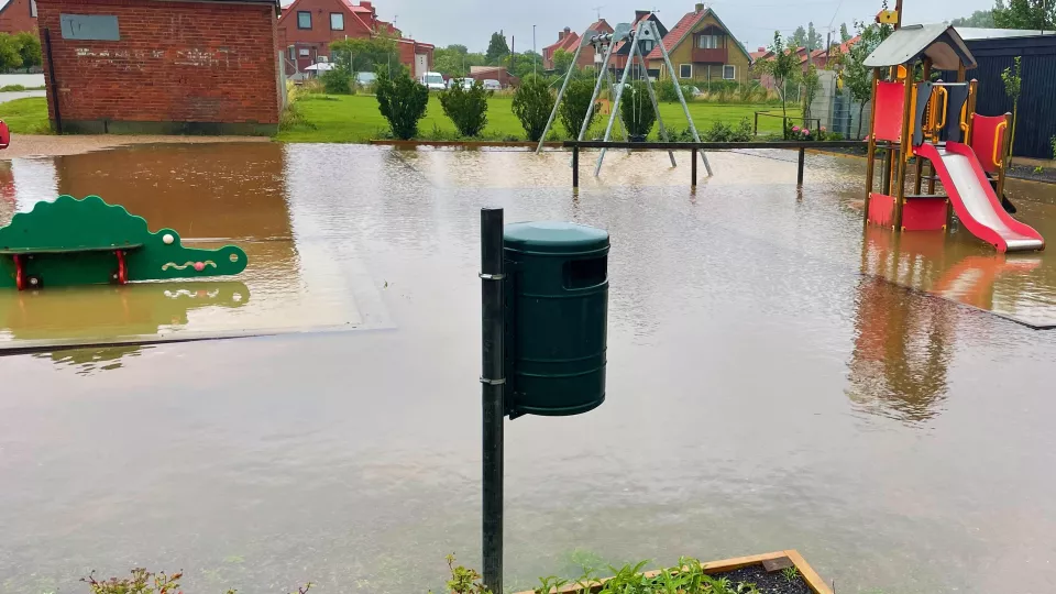 Photograph of a flooded playground.